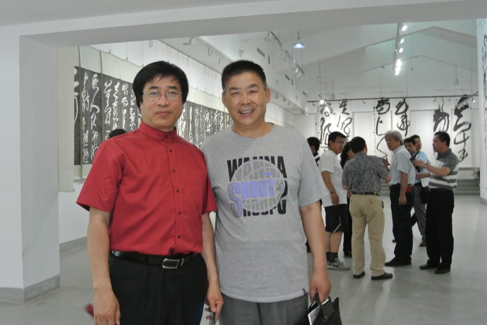 王登武与中国人民革命军事博物馆美术书法创作中心副主任兼秘书长张继